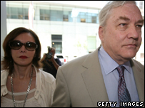 Black arriving in court with his wife