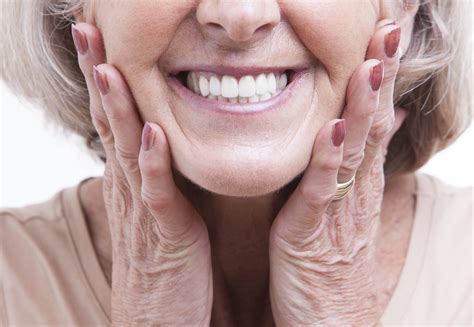 close up of older woman smiling with dentures - Duncan OK Dentist