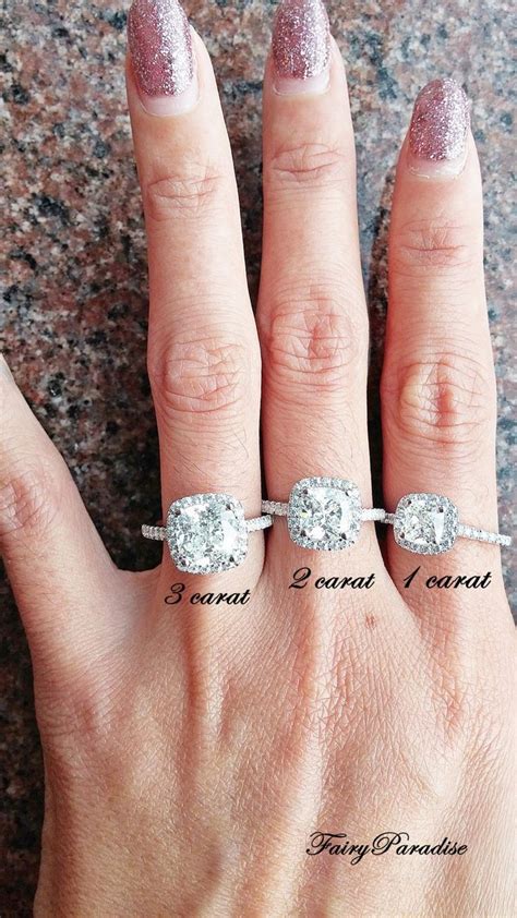 three different engagement rings on someone's hand with the words i ...