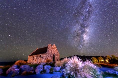 Premium Photo | The milky way over church of the good shepherd, lake ...