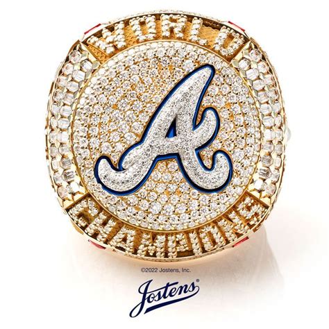 a ring with the letter a on it, surrounded by diamonds and blue enamel ...