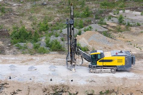 Drilling machine in open cast mining quarry Stock Photo by ©xtrekx 3483828