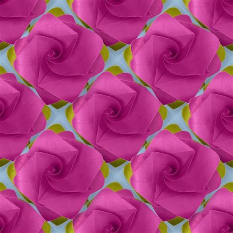 Premium Photo | Pink purple paper origami handmade rose on blue pattern