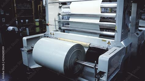 Roll of plastic sheet on industrial machine. Static shot of the ...