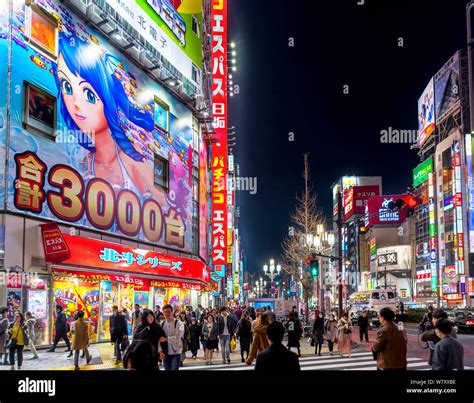 Neon signs and billboards at night on Yasukuni-dori, the main street in ...