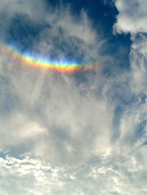 Clouds + upside down rainbow - Circumzenithal arc. Love those sun dogs ...