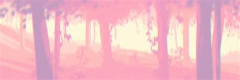 a blurry photo of trees with pink and yellow colors in the foreground ...