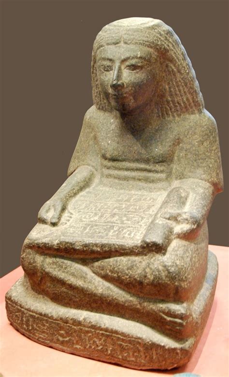 Ancient Egyptian statue, carved from diorite, of a seated scribe ...