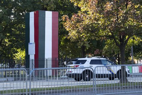 Box covering Columbus statue sports colors of Italian flag | AP News