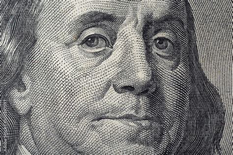 Portrait of Ben Franklin on the US 100 dollar bill in macro. Benjamin ...