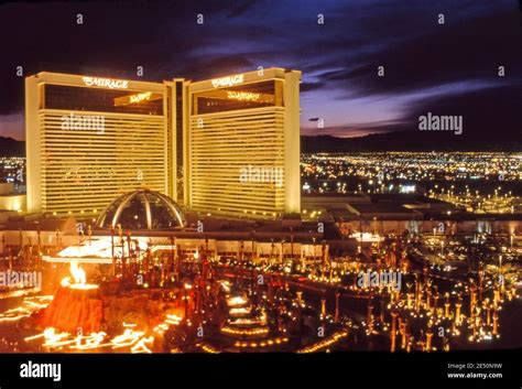 The Mirage Hotel with erupting volcano fountain at night on the Strip ...