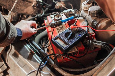 The process of repairing electronics in a car. Using a multimeter. Wire ...