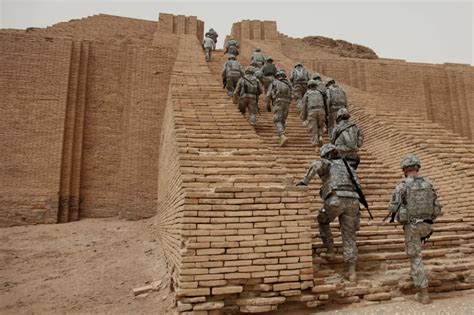 American soldiers walking up the reconstruction of Ur ziggurat. Build ...