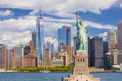 New York City Skyscrapers and Statue of Liberty on a Sunny Day