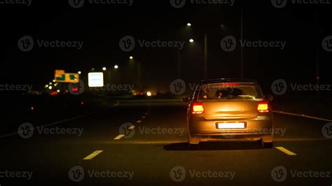 white car in night on Highway road 11083887 Stock Photo at Vecteezy