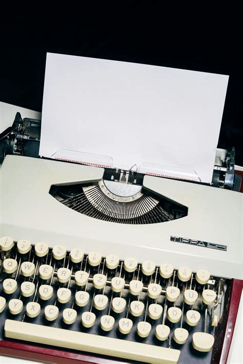 White and Black Typewriter on White Table · Free Stock Photo