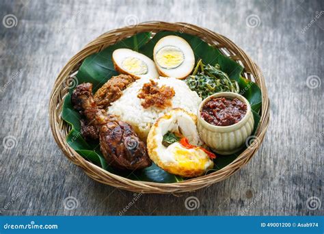 Nasi Ayam Penyet, Indonesian Fried Chicken Rice Stock Photo - Image of ...