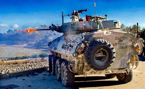 An ASLAV fires its 25mm M242 Bushmaster Chain gun during squad Support ...