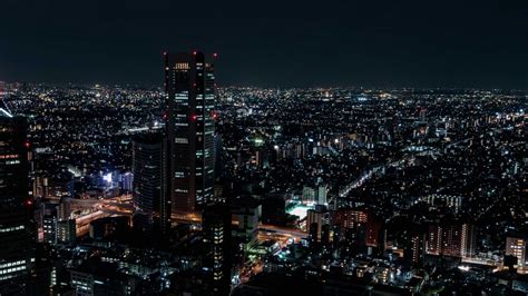 Download wallpaper 1366x768 night city, aerial view, city lights ...