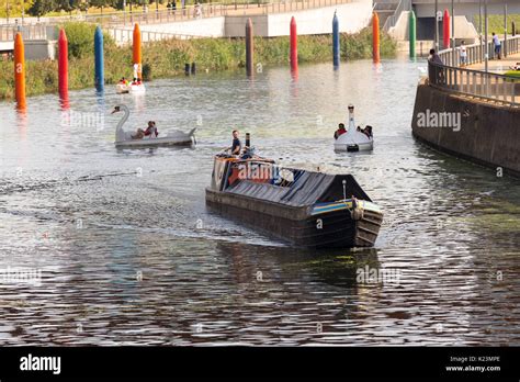 London, UK. 28th Aug, 2017. A canal boat travels along the canal on the ...