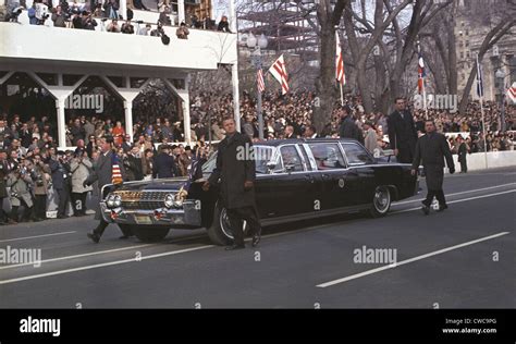 1965 Inauguration Parade. Lyndon and Lady Bird Johnson wave to crowds ...