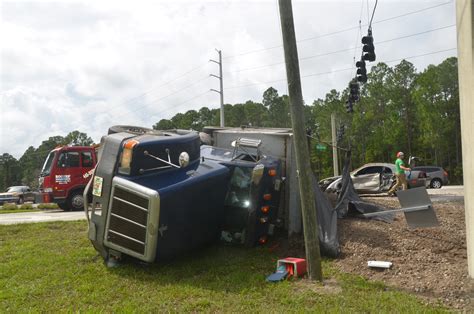 Dump Truck Overturns in Collision on Palm Coast Parkway and US1