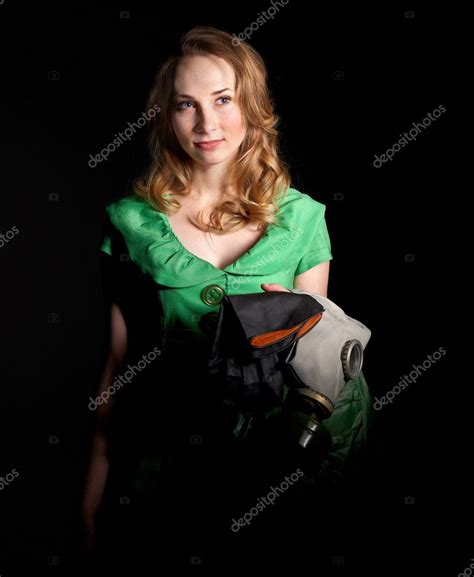 Woman holding flowers and gas mask . — Stock Photo © poznyakov #9077167