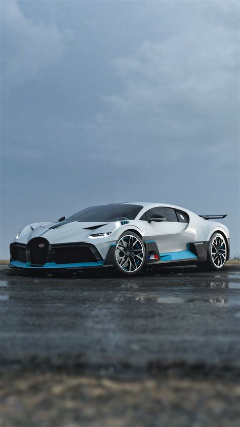 A white Bugatti Divo model car with blue accents standing on a wet road ...