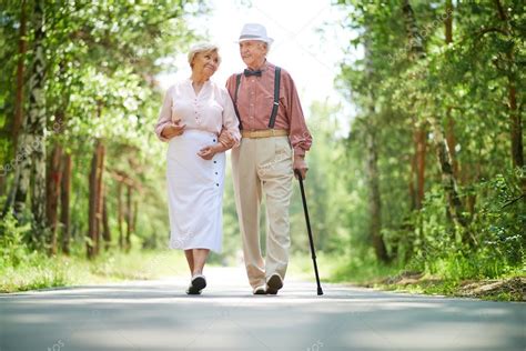 Happy seniors in park — Stock Photo © pressmaster #55488189