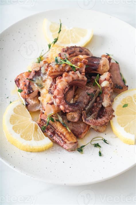 grilled octopus or squid with butter lemon sauce 4242742 Stock Photo at ...