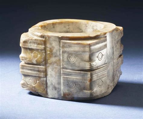 A rare and finely carved mottled opaque jade cong, Neolithic Period ...