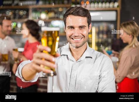 Young man smiling at camera Stock Photo - Alamy