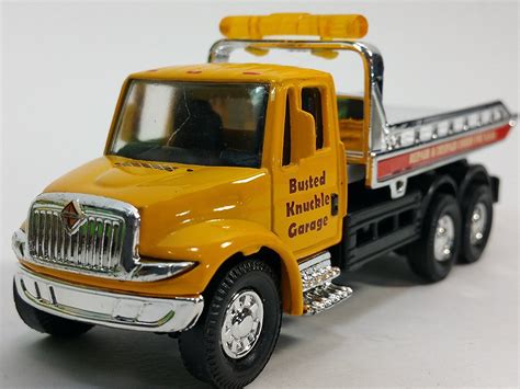 Showcast International Yellow Busted Knuckle Flatbed Tow Truck 1/64 ...