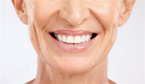 Teeth, Mouth and Smile of a Senior Woman with Dental Cleaning Against a ...