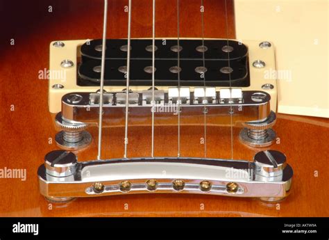 Close up view of pick ups and bridge from a gibson epiphone les paul ...