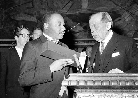 Dr. Martin Luther King Jr. receives the Nobel Peace Prize from the ...