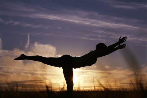 Premium Photo | Silhouette of a young girl yoga pose sunset sport