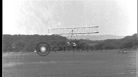 Ultralight biplane takes off, flies, and lands during flight testing in ...