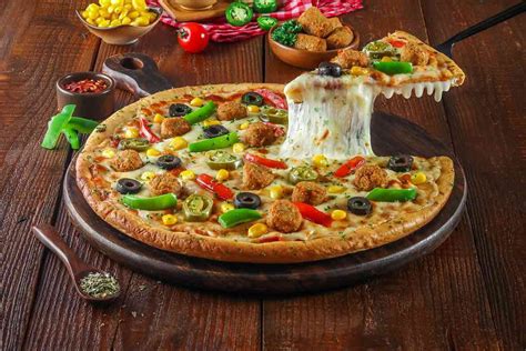 Order Veg Falafel Supreme Pizza Cheese Burst Pizza Medium online from ...