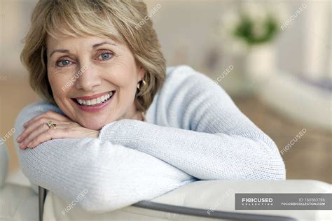 Attractive mature woman smiling — looking, Head In Hands - Stock Photo ...