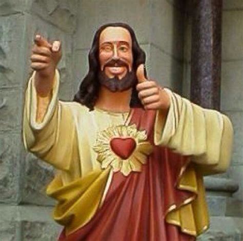 a statue of jesus giving the thumbs up