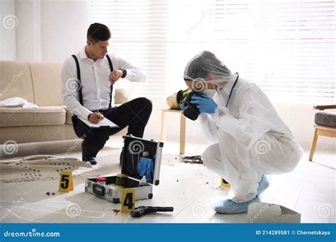 Investigators Working at Crime Scene in Living Room Stock Image - Image ...