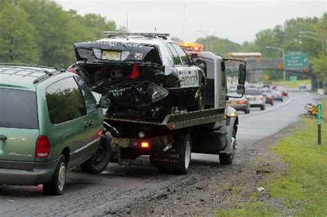 Police car is hit after cop tends to accident on Garden State Parkway ...