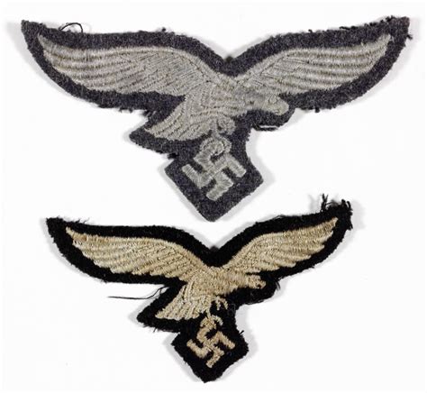 Sold at Auction: LUFTWAFFE CAP INSIGNIA (2)