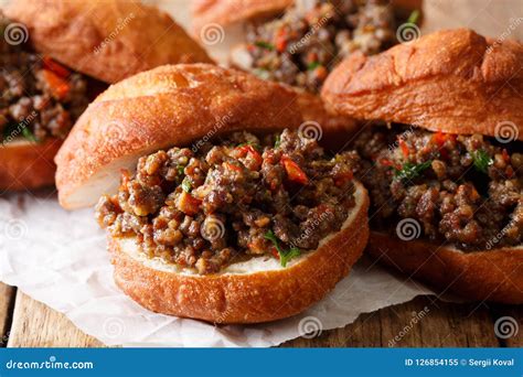 South African Food: Deep-fried Vetkoek Sandwich with Meat Curry Stock ...