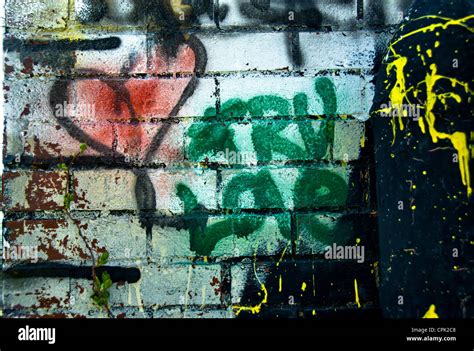 Colorful graffiti on a white brick wall Stock Photo - Alamy