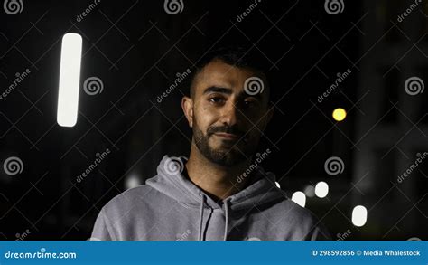 Portrait of a Young Man with Beard Looking at Camera and Smiling. Media ...