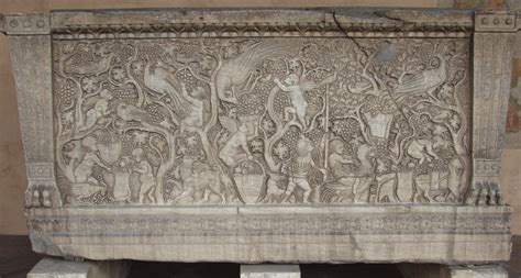 Late Roman sarcophagus depicting a vineyard harvested by cupids. While ...