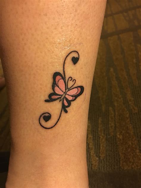 Feminine butterfly tattoo by the ankle with swirls and hearts. The ...