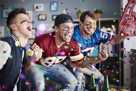 American football fans among falling confetti | Belo Media Group